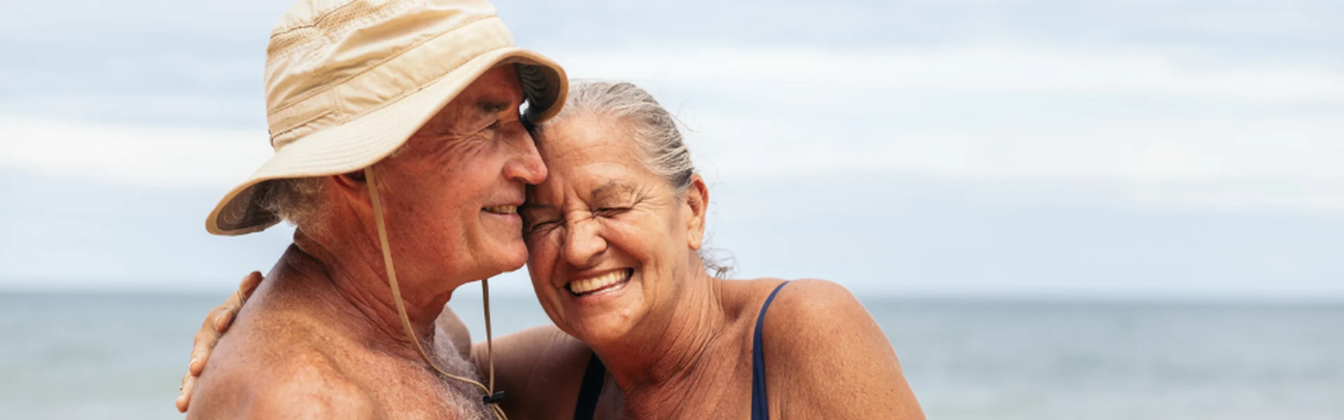 Couple embracing at the beach